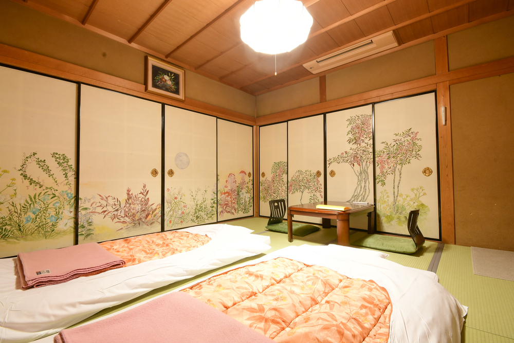[Standard Room] Japanese-style room with sliding doors and shared bathroom and toilet